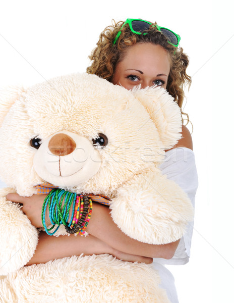 Teenage girl holding a teddy bear (no name or trademark) Stock photo © zurijeta