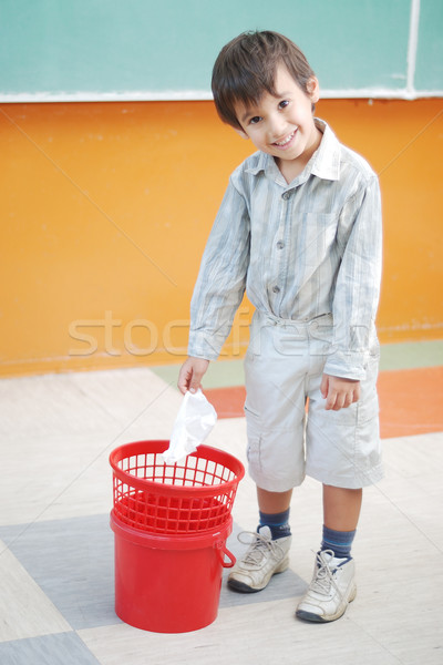 Little cute boy throwing paper in recycle bin Stock photo © zurijeta