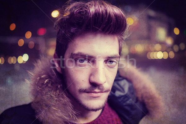 Young man on the night city street Stock photo © zurijeta