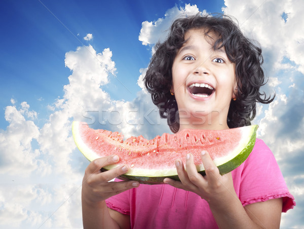 Caucasian girl offers a watermelon Stock photo © zurijeta