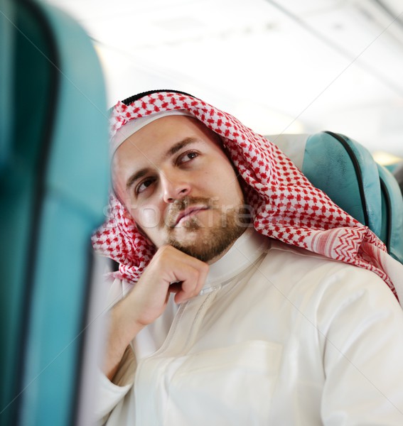 Modern Arabic businessman inside airplane Stock photo © zurijeta