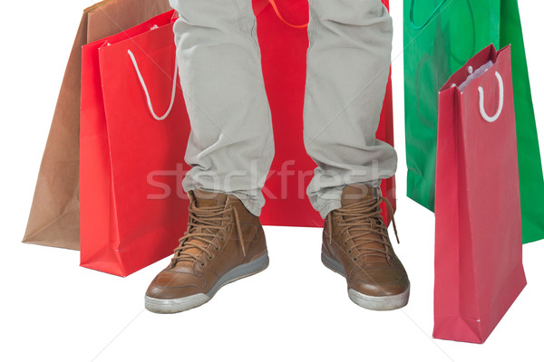 Man surrounded by shopping bags Stock photo © zurijeta