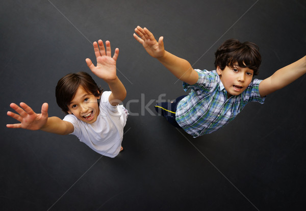 Criança saltando alto para cima criança trampolim Foto stock © zurijeta