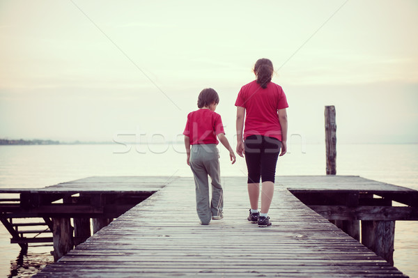 Ragazzo lago dock Italia spiaggia cielo Foto d'archivio © zurijeta