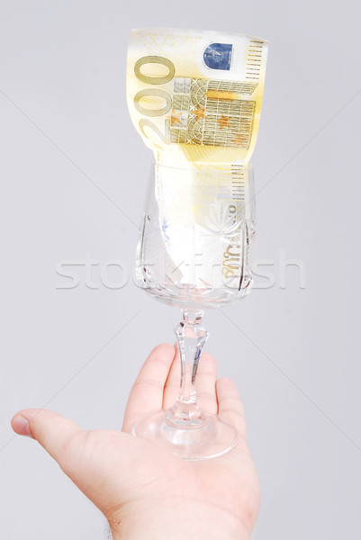 One hundred euro in glass on male hand Stock photo © zurijeta
