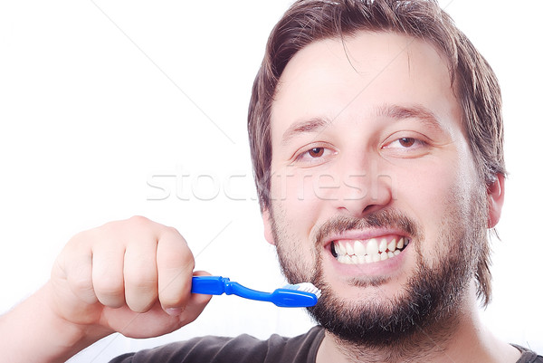белый здорового молодым человеком очистки зубов щетка Сток-фото © zurijeta