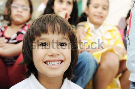 Large group, crowd, lot of happy children of different ages, summer outdoor sitting Stock photo © zurijeta