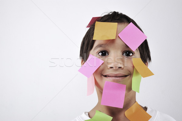 Little boy with memo posts on his face Stock photo © zurijeta
