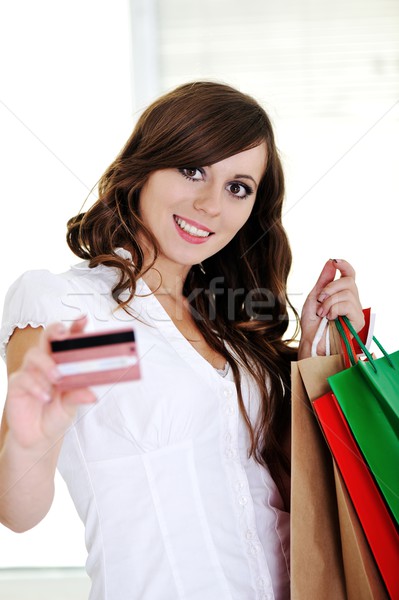 Vásárlás nő mutat névjegy mosolyog üzlet Stock fotó © zurijeta