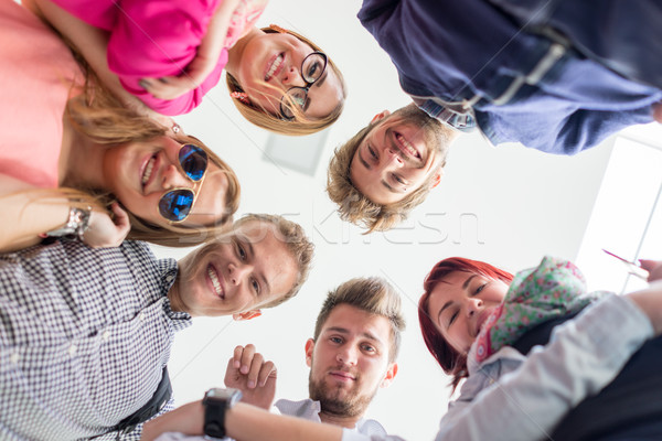 Group of happy young people in circle Stock photo © zurijeta