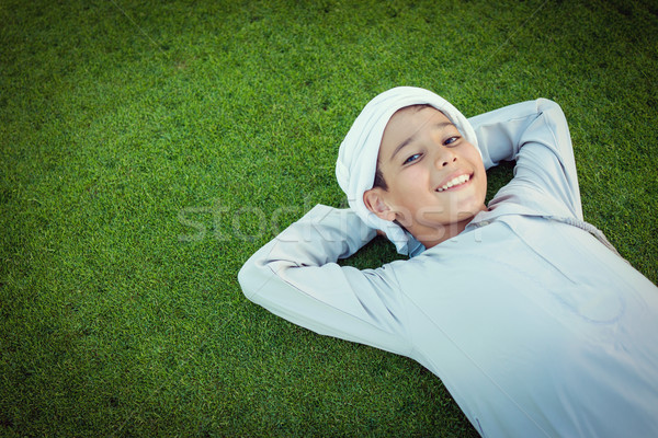 Feliz árabe criança grama verde cara grama Foto stock © zurijeta