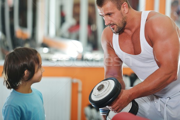 Athletic bodybuilder, execute exercise in sport gym hall Stock photo © zurijeta