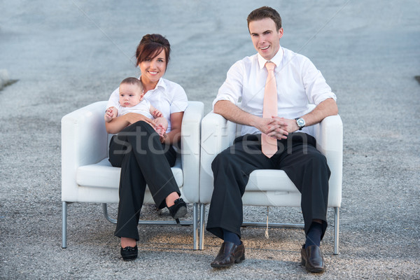 Smiling parents sitting in armchairs Stock photo © zurijeta