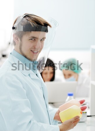 Young dentist at work in the office Stock photo © zurijeta