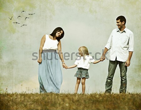 Retro image of happy family in nature having fun Stock photo © zurijeta