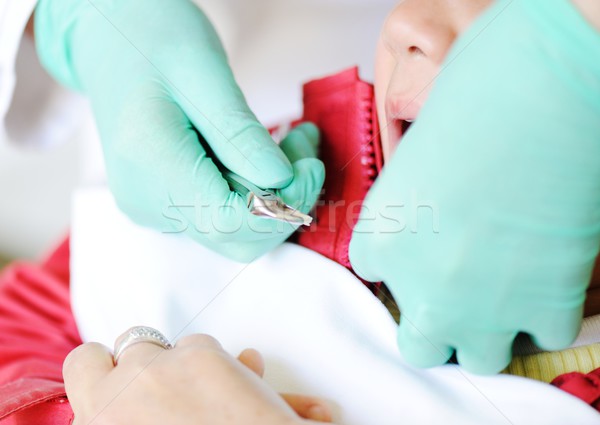 Kid visiting dentist office in hospital for pulling out milk too Stock photo © zurijeta