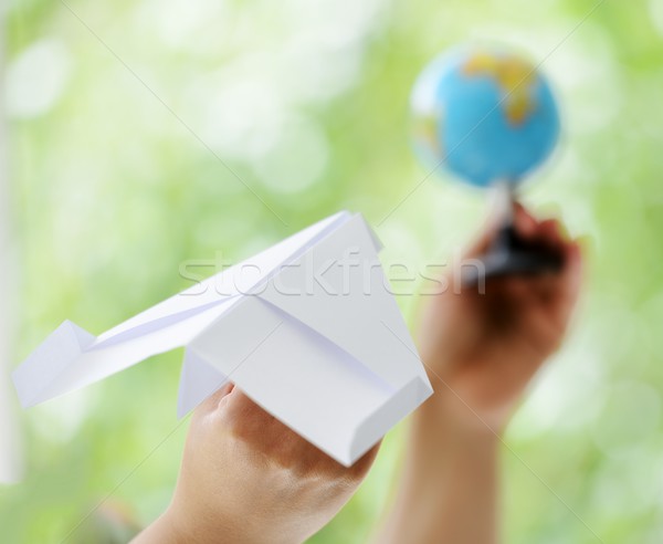 Paper plane traveling to globe world Stock photo © zurijeta