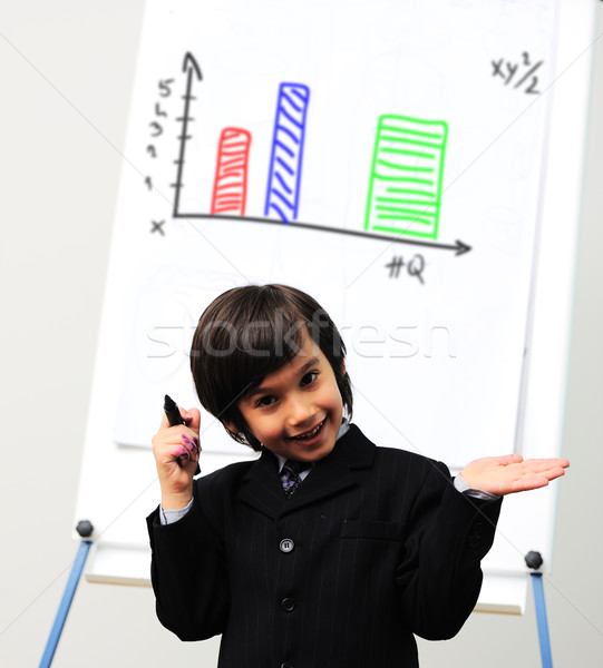 Little kid  drawing a  diagram on a whiteboard, future presentation Stock photo © zurijeta
