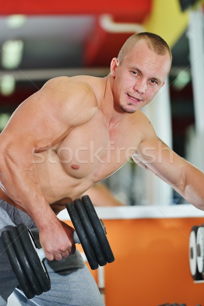 Stock photo: Athletic bodybuilder, execute exercise in sport gym hall