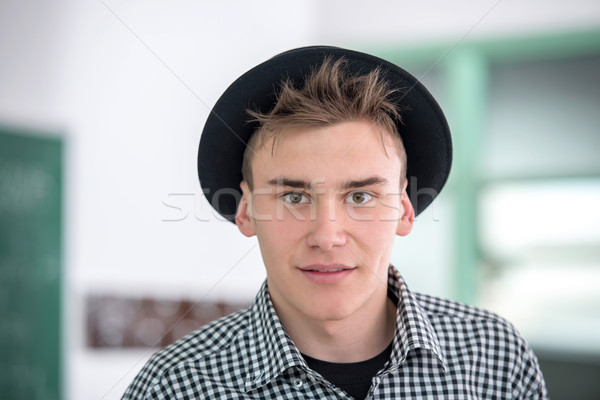 Iskolás fiú pózol jóképű kalap mosoly diák Stock fotó © zurijeta