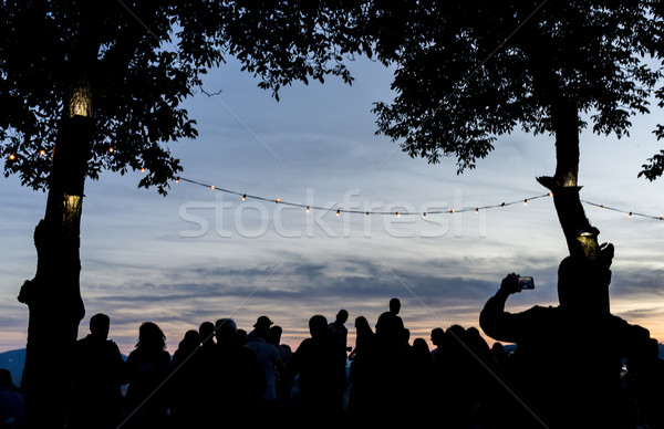Crowd people together outdoor waiting for sunset Stock photo © zurijeta