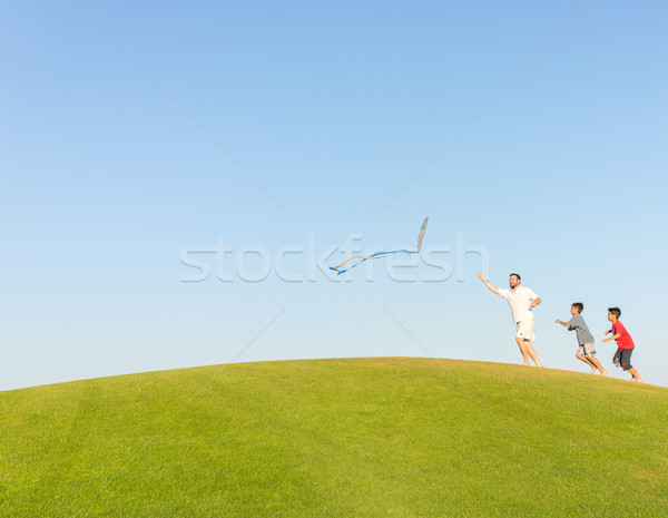 Stock photo: Running with kite on summer holiday vacation, perfect meadow and