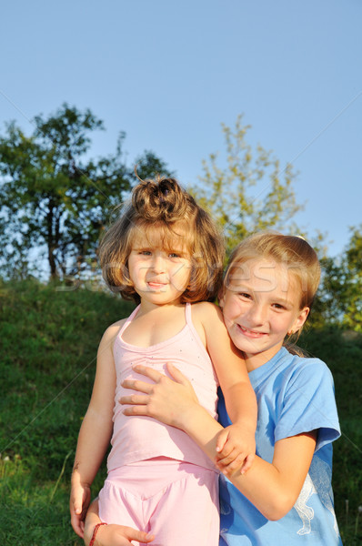 Dos niñas pie junto parque uno Foto stock © zurijeta