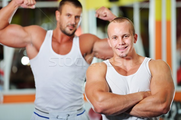 Athletic bodybuilder, execute exercise in sport gym hall Stock photo © zurijeta