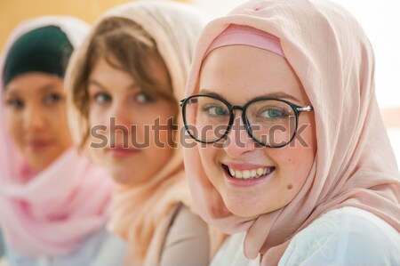 Casual group of students looking happy and smiling Stock photo © zurijeta