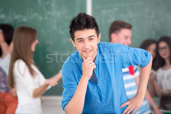 Boy posing in front of chalkboard Stock photo © zurijeta