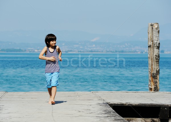 Wenig Junge Fuß Dock schönen Meer Stock foto © zurijeta