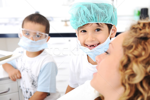 Kid Dentist's teeth checkup, series of related photos Stock photo © zurijeta