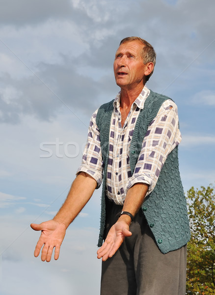 Middle aged male person with interesting gestures Stock photo © zurijeta