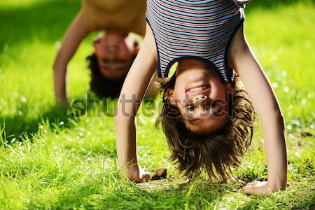 Group of happy children playing outdoors in spring park Stock photo © zurijeta