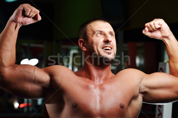 Athletic bodybuilder, execute exercise in sport gym hall Stock photo © zurijeta