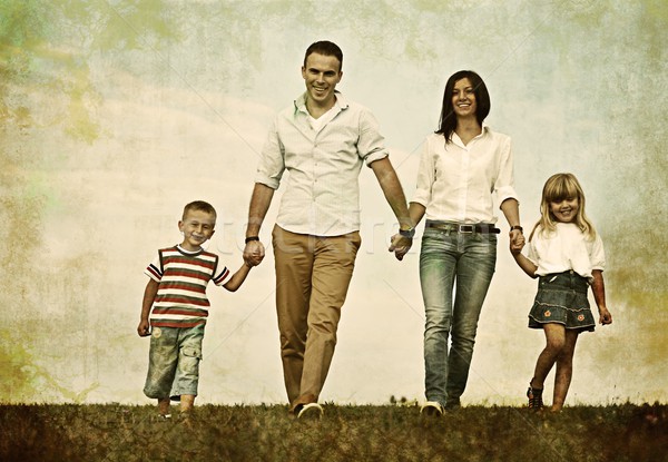Filtered colorized image of a happy family in nature having fun Stock photo © zurijeta