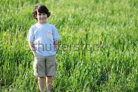 Kid making toilet on grass in park Stock photo © zurijeta