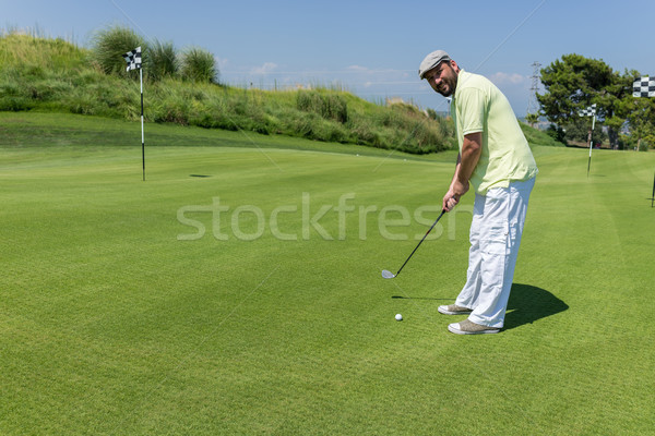 Man playing golf at club Stock photo © zurijeta