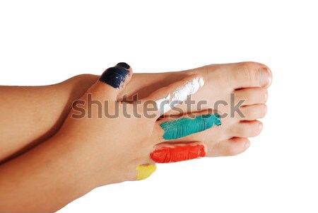 Colors on child's hand and hand on the leg Stock photo © zurijeta