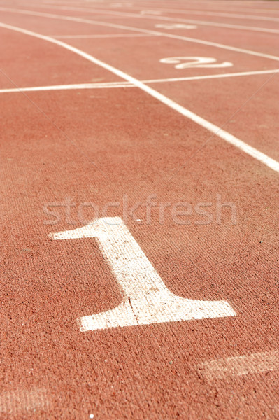 Numbers on running track, one 1 for winner Stock photo © zurijeta