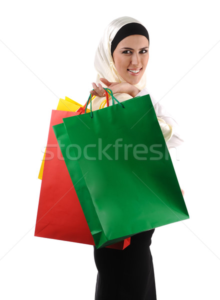 Beautiful Muslim traditional but modern woman holding shopping bags Stock photo © zurijeta