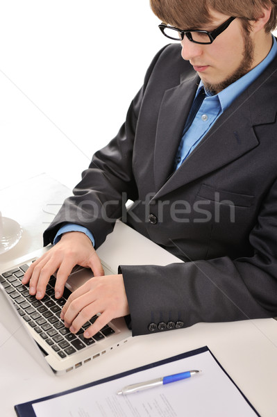 Young businessman working with laptop Stock photo © zurijeta