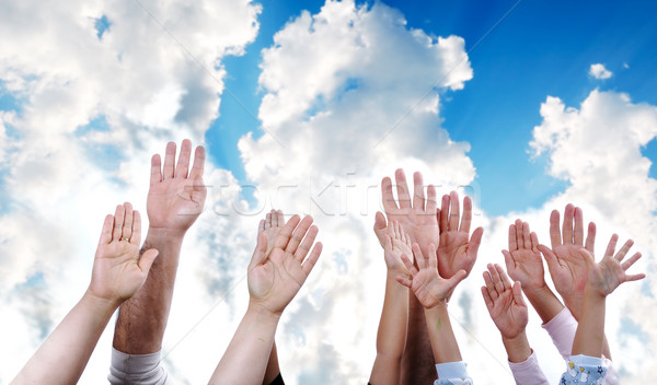 Many hands rising the sky together, children and adults Stock photo © zurijeta