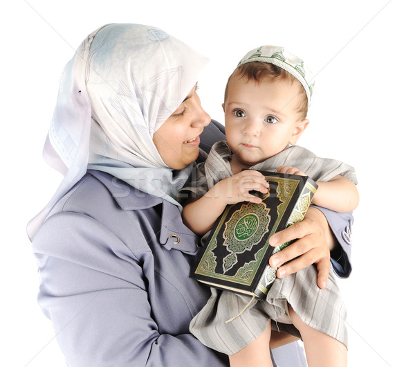 Muslim mother and her little son holding a Koran Stock photo © zurijeta