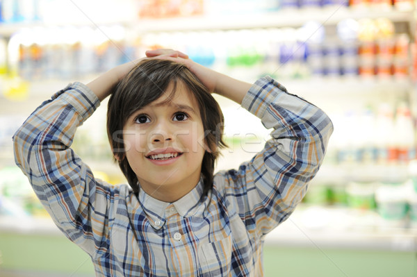 Kid with hands on his head in shopping mall Stock photo © zurijeta