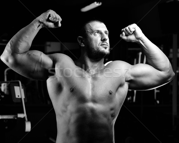 Athletic bodybuilder, execute exercise in sport gym hall Stock photo © zurijeta