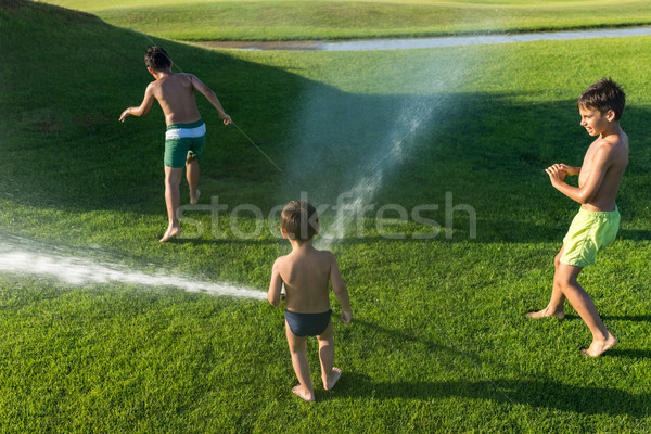 The best summer holiday vacation for splashing sprinkle water Stock photo © zurijeta