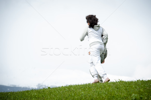 мальчика девушки работает прыжки весны области Сток-фото © zurijeta