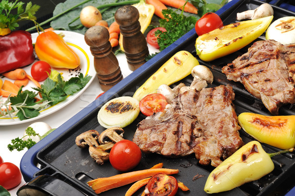 Barbecue, prepared beef meat and different vegetables and mushrooms on grill Stock photo © zurijeta