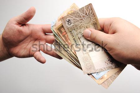 Giving money Stock photo © zurijeta